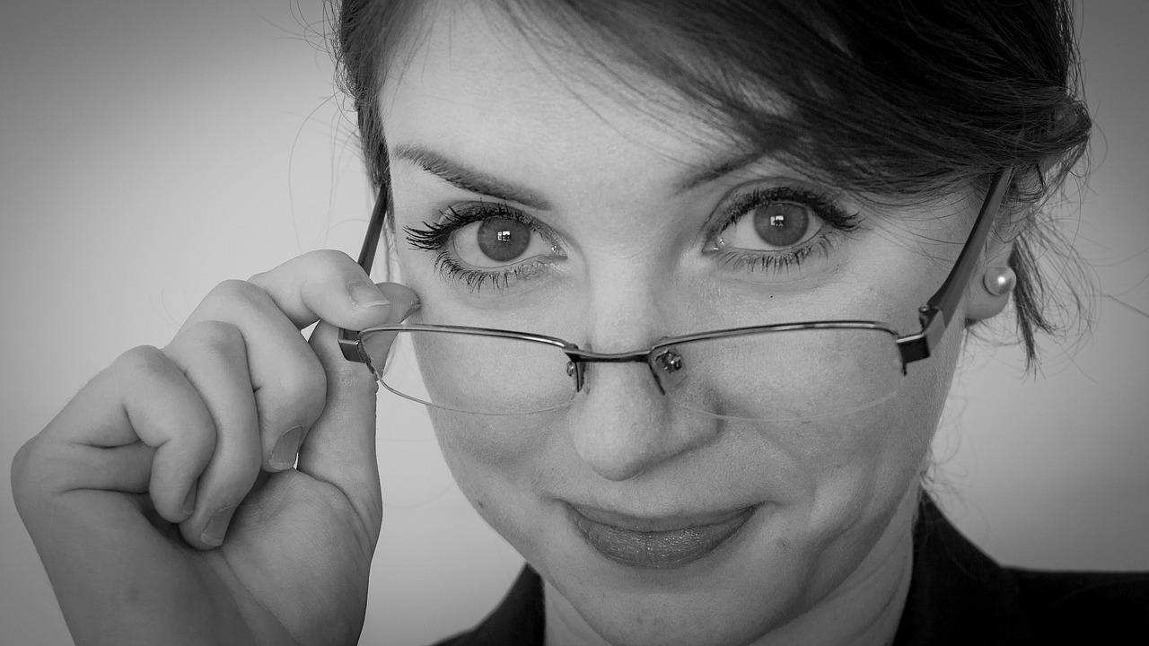 woman with glasses pulled down